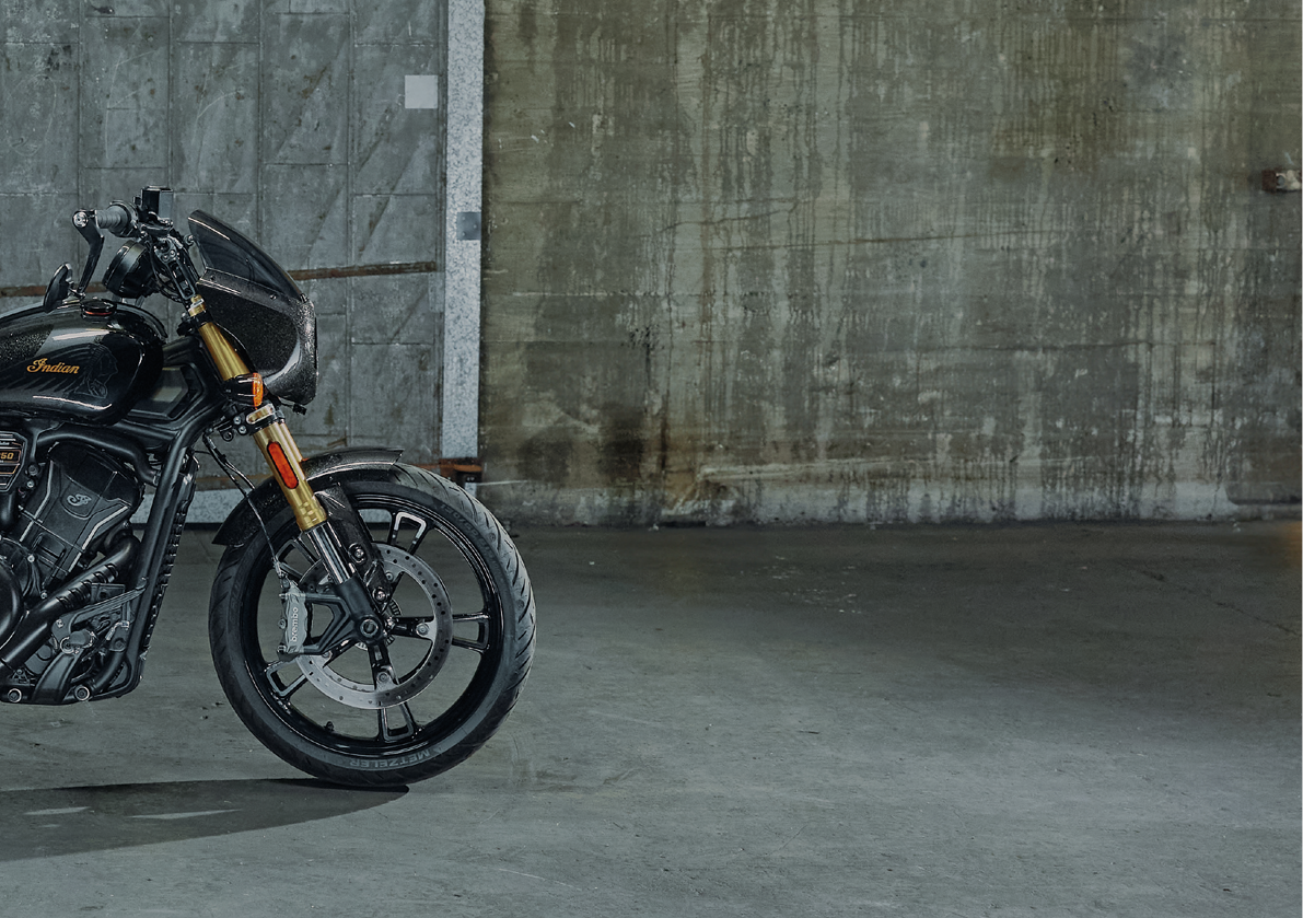 A black motorcycle is parked in a garage. AI generated content